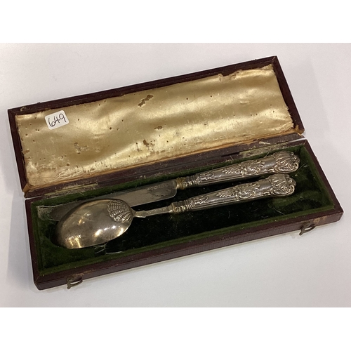 649 - A small silver two-piece King's pattern christening set. Est. £20 - £30.