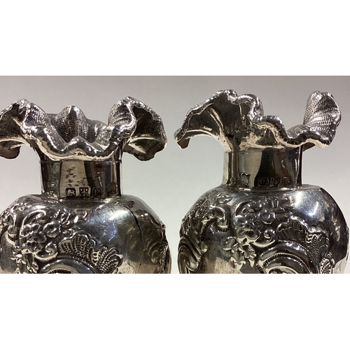 65 - CHESTER: A pair of Victorian silver vases. 1890. Approx. 282 grams. Est. £100 - £150.