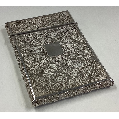 651 - A good quality filigree silver card case with hinged top. Apparently unmarked. Approx. 72 grams. Est... 