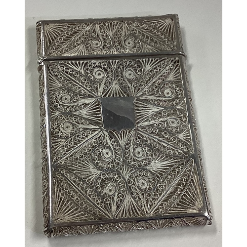 651 - A good quality filigree silver card case with hinged top. Apparently unmarked. Approx. 72 grams. Est... 