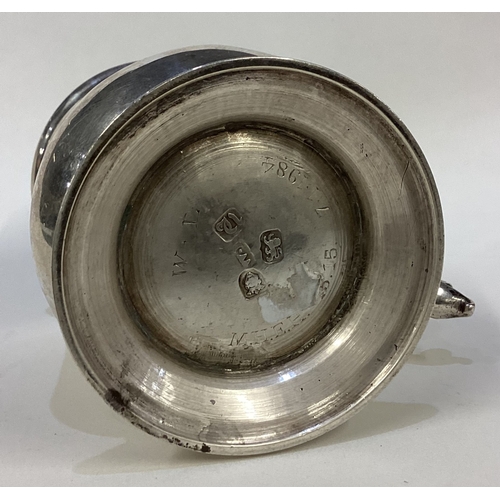 657 - A small baluster shaped silver mug on spreading foot. Approx. London. By WL. Approx. 200 grams. Est.... 