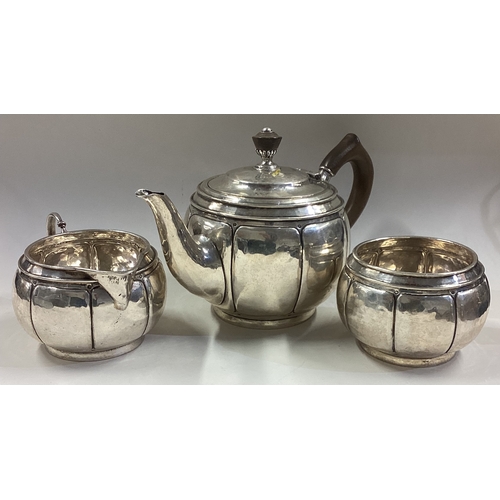 658 - LIBERTY & CO: A good bachelor's three-piece silver tea service of panelled form. Birmingham. Approx.... 