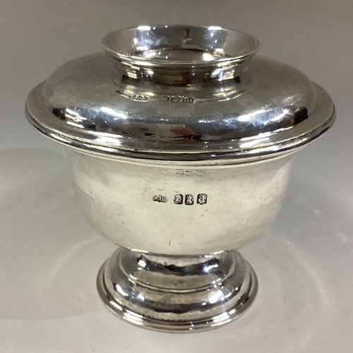 659 - An unusual textured silver jar and cover on circular spreading base. London. By RJA. Approx. 360 gra... 