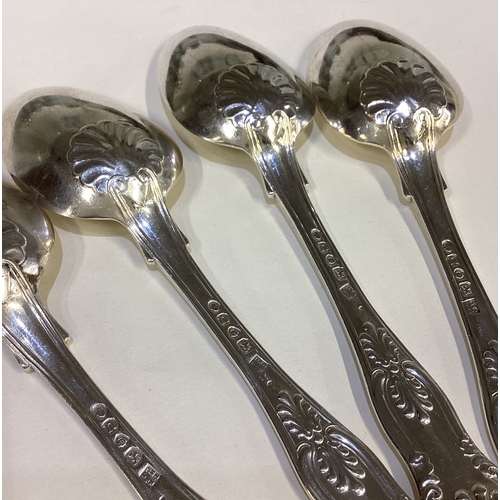 672 - A heavy set of four silver King's pattern dessert spoons. London. Approx. 199 grams. Est. £100 - £15... 