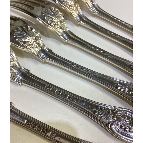 675 - A set of six silver King's pattern table forks. London. Approx. 501 grams. Est. £150 - £200.