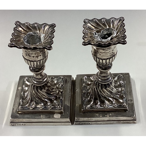 68 - A fine pair of Victorian silver candlesticks with fluted decoration. Sheffield 1888. By JKB. Approx.... 