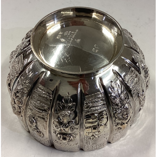 696 - A boxed Victorian silver sugar bowl attractively decorated with birds and animals. London. By FBT. A... 