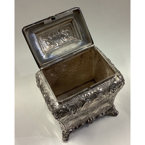 79 - GLASGOW: A fine chased Victorian Scottish silver tea caddy with hinged lid. 1859. By J Muirhead & So... 