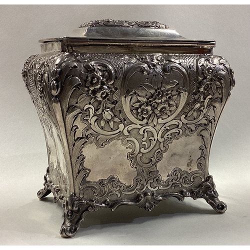 79 - GLASGOW: A fine chased Victorian Scottish silver tea caddy with hinged lid. 1859. By J Muirhead & So... 