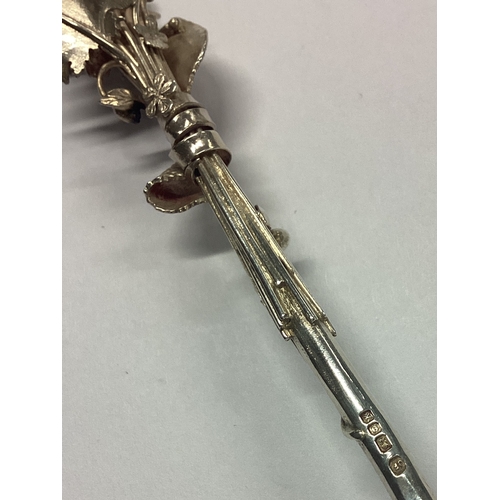 87 - A stylish cast silver spoon with foxglove terminal. London. By JF. Approx. 37 grams. Est. £100 - £15... 