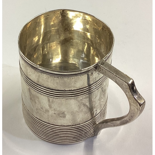 91 - A Georgian silver mug with reeded decoration. London 1791. By TD. Approx. 100 grams. Est. £100 - £15... 