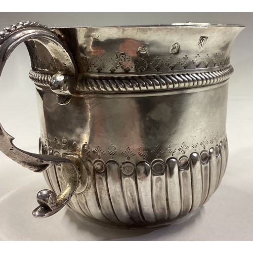 99 - An 18th Century Queen Anne silver porringer. London 1704. Approx. 193 grams. Est. £600 - £800.