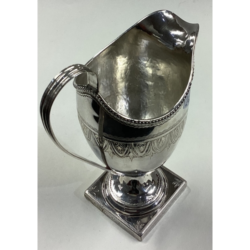 268 - An 18th Century George III silver jug with bright-cut decoration. London 1771. Approx. 118 grams. Es... 