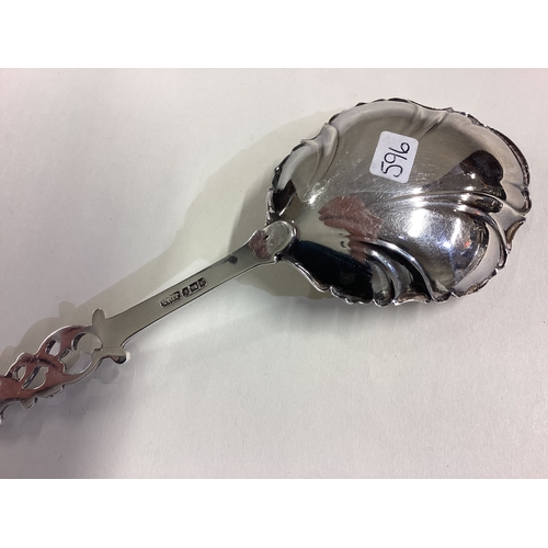 596 - A heavy pierced silver spoon with fluted bowl. Sheffield. Approx. 55 grams. Est. £30 - £50.