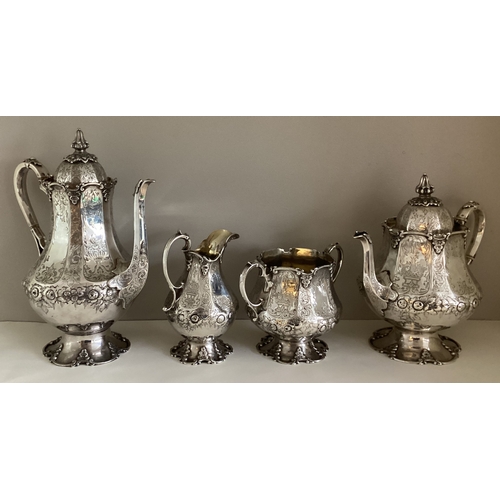 699 - EXETER: A fine quality large silver four-piece tea and coffee service with panelled body profusely d... 