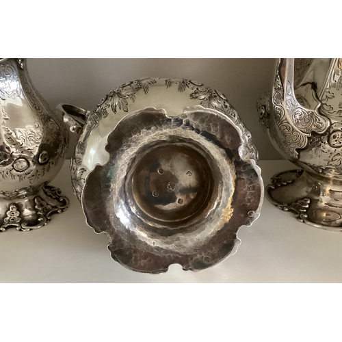 699 - EXETER: A fine quality large silver four-piece tea and coffee service with panelled body profusely d... 