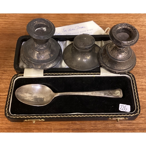 226 - A silver mounted inkwell, candlesticks etc. Approx. 204 grams of gross weight. Est. £20 - £30.