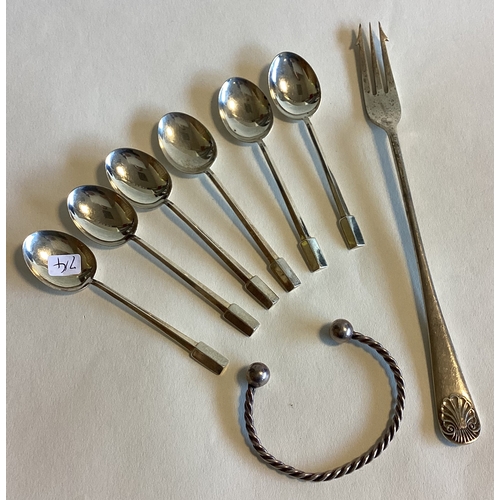 714 - A set of six silver coffee spoons together with a pickle fork etc. Various dates and makers. Approx.... 