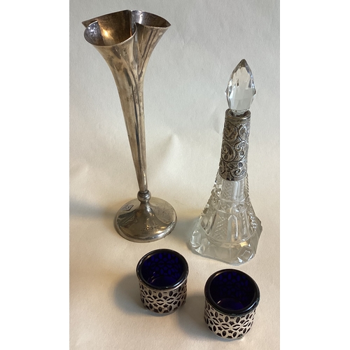 715 - A pair of silver mounted salts together with a spill vase etc. Est. £20 - £30.