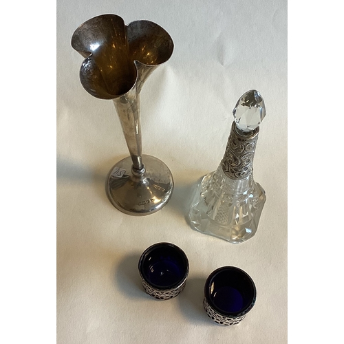 715 - A pair of silver mounted salts together with a spill vase etc. Est. £20 - £30.