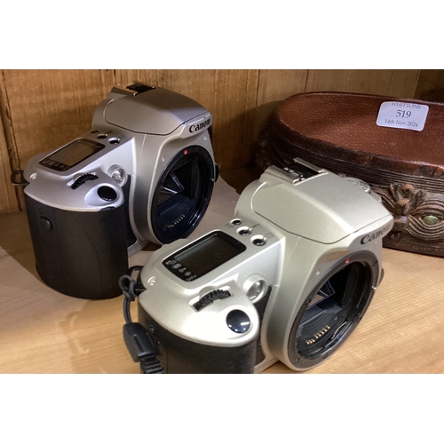 164 - Two Canon cameras together with a leather basket. Est. £10 - £20.