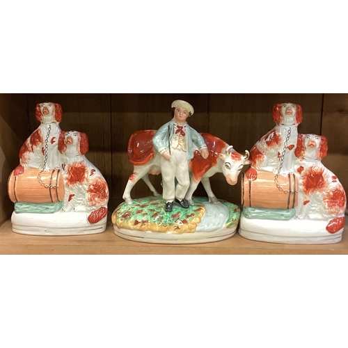 169 - A group of three Staffordshire figures. Est. £20 - £30.