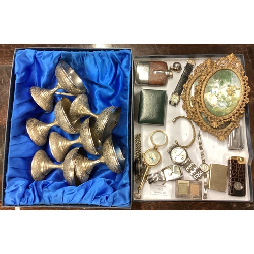 219 - A box containing watches, goblets etc. Est. £30 - £40.