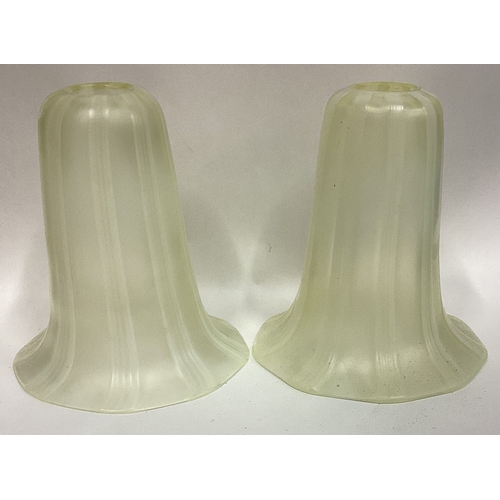 227 - A pair of green glass lamp shades. Est. £20 - £30.