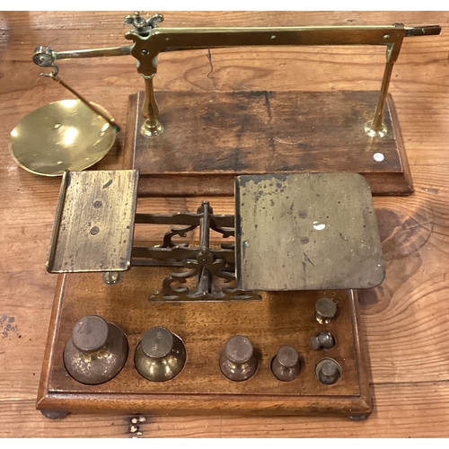 232 - Two sets of Antique brass postal scales. Est. £30 - £40.