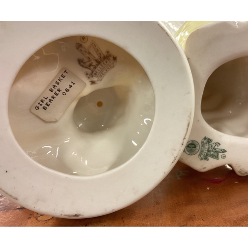 235 - A pair of Belleek vases decorated with children together with one other. Est. £30 - £50.