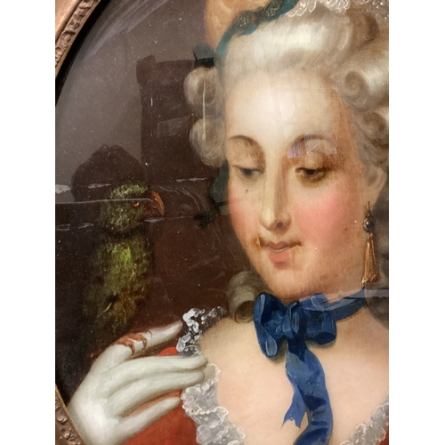 33 - An oval gilt framed and glazed oil on glass reverse portrait of a lady with parrot. Apparently unsig... 