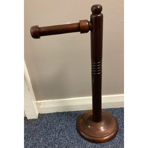 412 - A turned mahogany toilet roll holder. Est. £20 - £30.