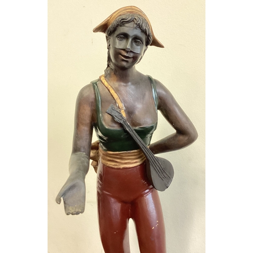 433 - A large bronzed figure of a lady in standing position. Est. £30 - £50.