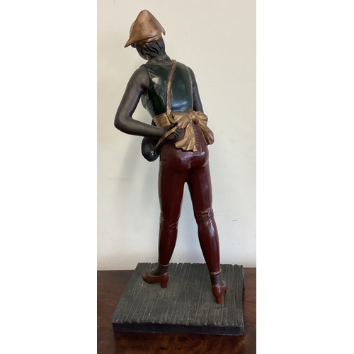 433 - A large bronzed figure of a lady in standing position. Est. £30 - £50.