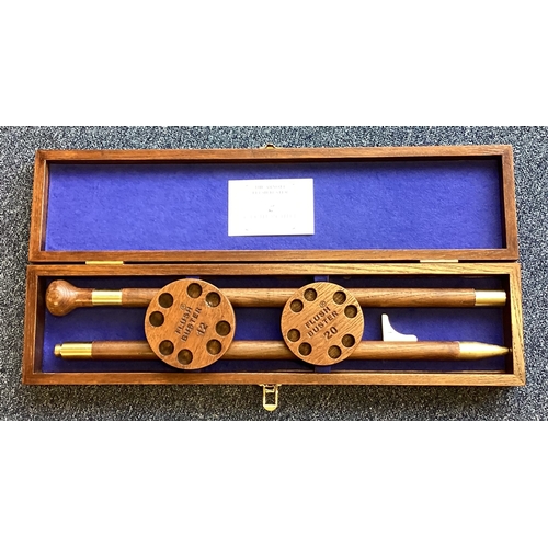 436 - An unusual mahogany cased shot gun cartridge holder. Est. £40 - £60.