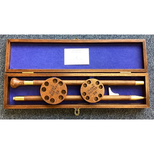 437 - An unusual mahogany cased shot gun cartridge holder. Est. £40 - £60.