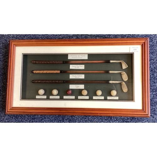 448 - A small framed and glazed picture depicting golf clubs. Est. £30 - £40.