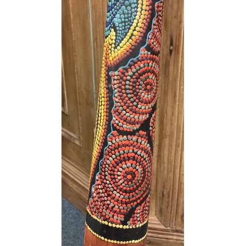 462 - A large painted didgeridoo. Est. £20 - £30.