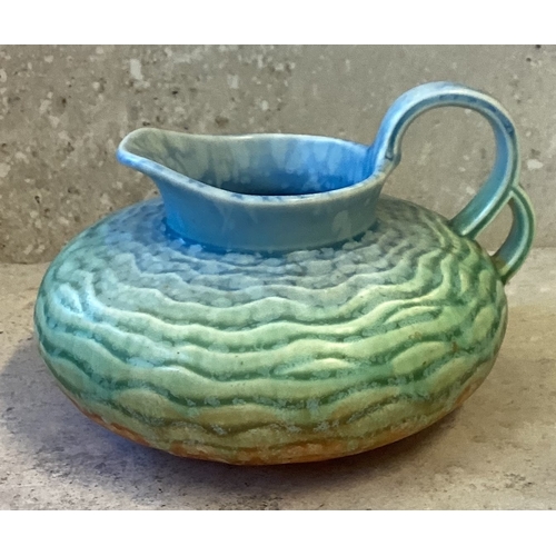 470 - A tricolour Wedgwood double loop handle jug in blue to orange gradient glaze and ripple pattern. Mar... 