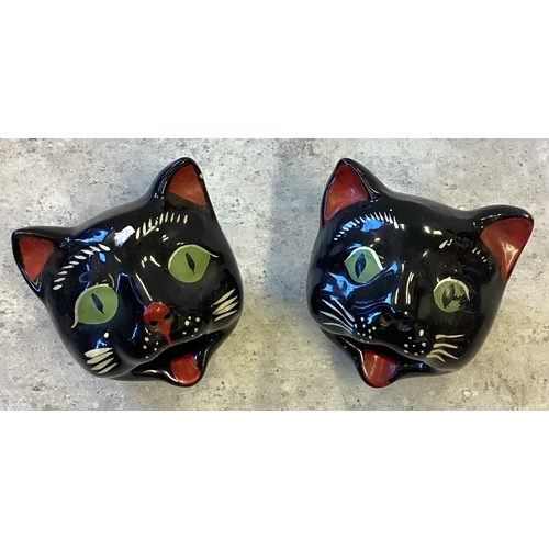 471 - A pair of Staffordshire Norcrest Redware pottery ashtrays in the form of black cat's heads. Approx. ... 