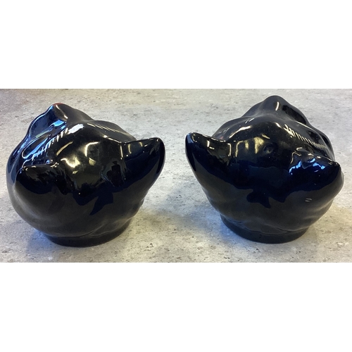 471 - A pair of Staffordshire Norcrest Redware pottery ashtrays in the form of black cat's heads. Approx. ... 