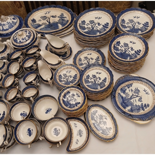 476 - A Booth's Real Old Willow pattern dinner service. Est. £20 - £30.