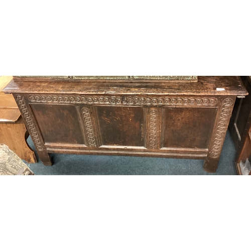 723 - A Georgian oak three-panel coffer with carved decoration. Est. £80 - £120.