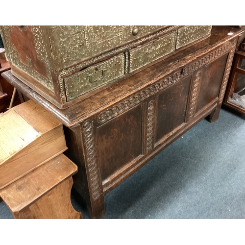 723 - A Georgian oak three-panel coffer with carved decoration. Est. £80 - £120.