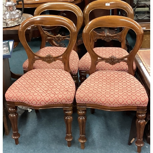 730 - A set of four upholstered dining chairs on fluted supports. Est. £20 - £30.