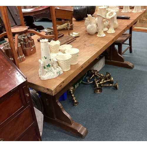 733 - A large pine farmhouse table. Est. £50 - £80.