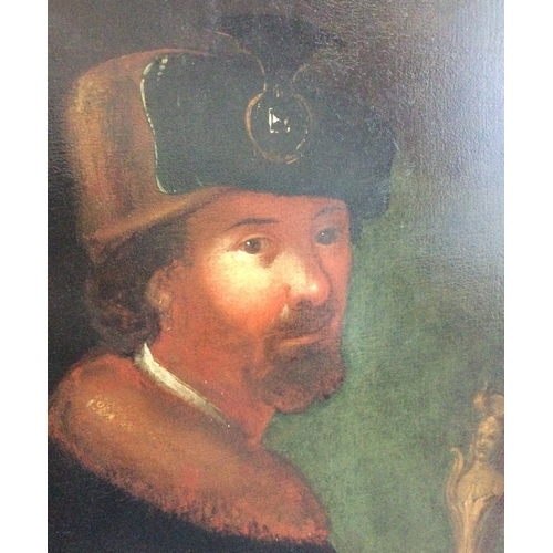 91 - GERMAN SCHOOL: A 17th Century oil on canvas depicting a portrait of a merchant holding an ornate ivo... 