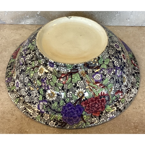 474 - A decorative ironstone bowl in bright colours. Est. £20 - £30.