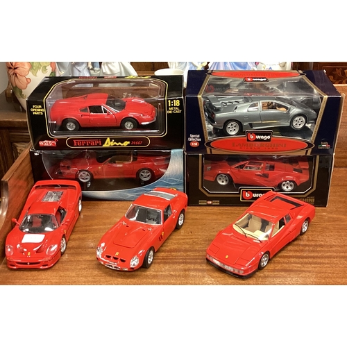 484 - A group of seven 1:18 scale model cars. Est. £20 - £30.