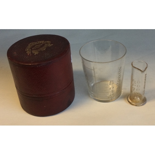 495A - An Antique medicine glass and minim measure in original box. Est. £10 - £20.